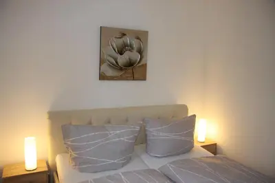 Ein Bett oder Betten in einem Zimmer der Unterkunft Ferienwohnung Am Steinbachtal