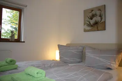 Ein Bett oder Betten in einem Zimmer der Unterkunft Ferienwohnung Am Steinbachtal