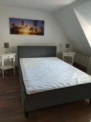 Ein Bett oder Betten in einem Zimmer der Unterkunft Eddy's Stadt Appartement