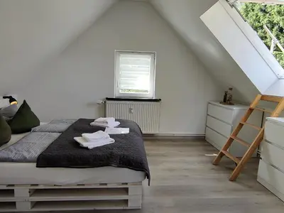 Ein Bett oder Betten in einem Zimmer der Unterkunft FaFeWo Ferienwohnungen mit Sternekomfort in Tanne Harz