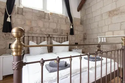 Ein Bett oder Betten in einem Zimmer der Unterkunft Ferienwohnung mit Brunnen