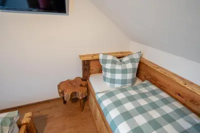 Ein Bett oder Betten in einem Zimmer der Unterkunft Eggert's Ferienhaus zum Apfelgarten
