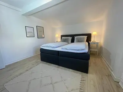 Ein Bett oder Betten in einem Zimmer der Unterkunft Ferienwohnung Am Bündheimer Schloss