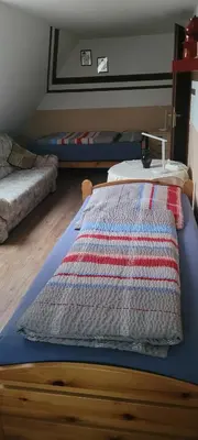 Ein Bett oder Betten in einem Zimmer der Unterkunft Ferienwohnung Halberstadt