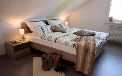 Ein Bett oder Betten in einem Zimmer der Unterkunft Ferienwohnung Rehblick