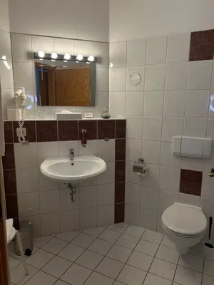Ein Badezimmer in der Unterkunft Hotel Am Grudenberg