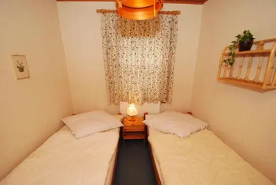 Ein Bett oder Betten in einem Zimmer der Unterkunft Ferienhaus Kamin