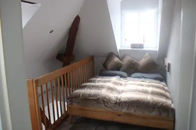 Ein Bett oder Betten in einem Zimmer der Unterkunft Palais Picard Ostflügel