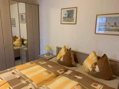 Ein Bett oder Betten in einem Zimmer der Unterkunft Ferienwohnungen Rießling