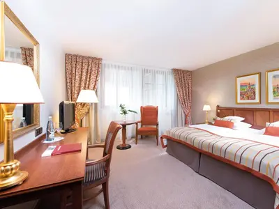Ein Bett oder Betten in einem Zimmer der Unterkunft A-ROSA Gothisches Haus Wernigerode