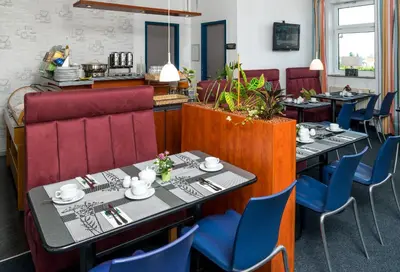 Ein Sitzbereich in der Unterkunft Median Hotel Garni