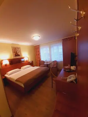 Ein Bett oder Betten in einem Zimmer der Unterkunft Altwernigeröder Apparthotel
