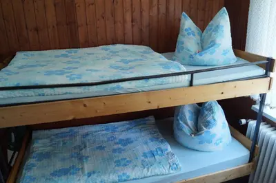 Ein Bett oder Betten in einem Zimmer der Unterkunft Pension Jagdhütte