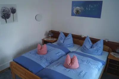 Ein Bett oder Betten in einem Zimmer der Unterkunft Pension Jagdhütte