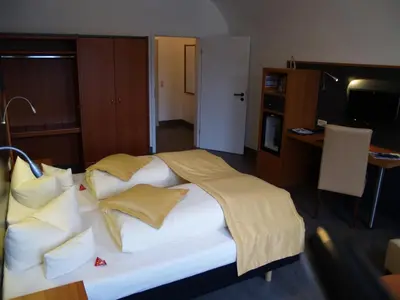 Ein Bett oder Betten in einem Zimmer der Unterkunft Hotel Goldene Krone