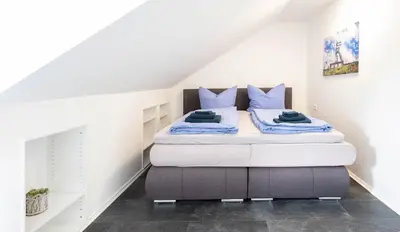 Ein Bett oder Betten in einem Zimmer der Unterkunft Haus der Elemente