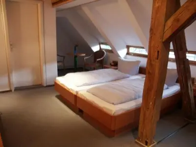 Ein Bett oder Betten in einem Zimmer der Unterkunft La Rustica Altstadthotel