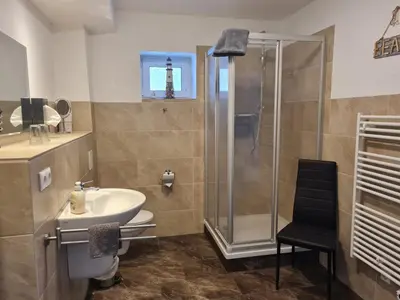 Ein Badezimmer in der Unterkunft Harz Pension