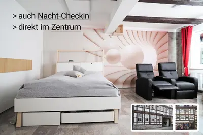 Ein Bett oder Betten in einem Zimmer der Unterkunft Design-Ferienwohnungen Stadtidyll