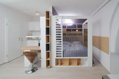 Ein Bett oder Betten in einem Zimmer der Unterkunft Design-Ferienwohnungen Stadtidyll