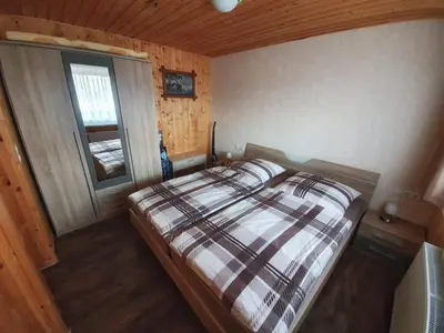 Ein Bett oder Betten in einem Zimmer der Unterkunft Ferienhäuser in Allrode