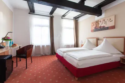Ein Bett oder Betten in einem Zimmer der Unterkunft Halberstädter Hof