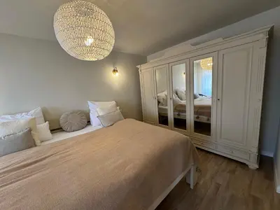 Ein Bett oder Betten in einem Zimmer der Unterkunft Quedlinburg Marktplatz-Suites