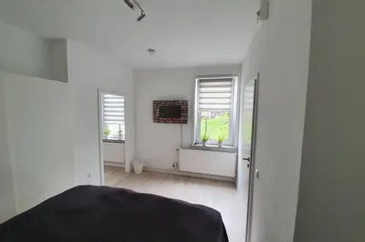 Ein Bett oder Betten in einem Zimmer der Unterkunft Ehem. Berg Apotheke