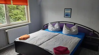 Ein Bett oder Betten in einem Zimmer der Unterkunft Apartments Carmen