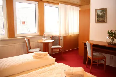 Ein Bett oder Betten in einem Zimmer der Unterkunft Hotel Garni Kaiserpfalz