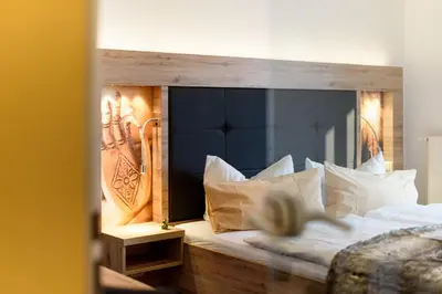 Ein Bett oder Betten in einem Zimmer der Unterkunft Wellness & Ayurveda Hotel Am Eichenberg