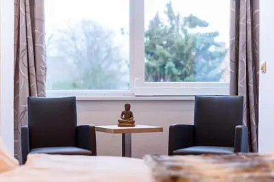Ein Bett oder Betten in einem Zimmer der Unterkunft Wellness & Ayurveda Hotel Am Eichenberg