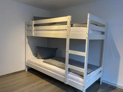 Ein Bett oder Betten in einem Zimmer der Unterkunft Ferienwohnung Hohensee EG