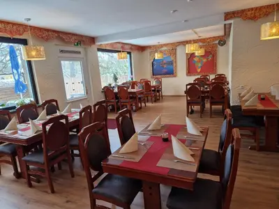 Ein Restaurant oder anderes Speiselokal in der Unterkunft Hotel PB