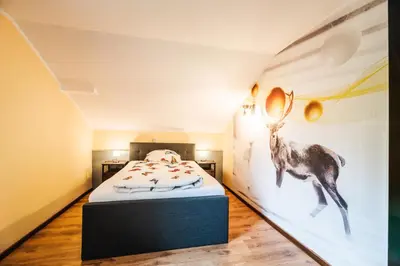 Ein Bett oder Betten in einem Zimmer der Unterkunft Landhotel Alte Aue