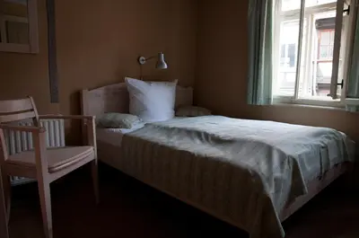 Ein Bett oder Betten in einem Zimmer der Unterkunft Hotel am Hoken
