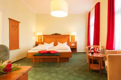 Ein Bett oder Betten in einem Zimmer der Unterkunft Hotel Victoria