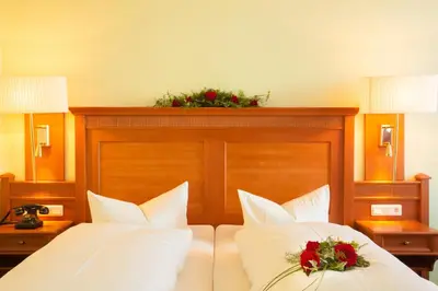 Ein Bett oder Betten in einem Zimmer der Unterkunft Hotel Victoria