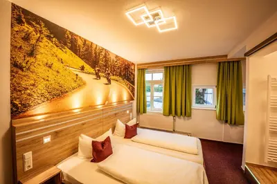 Ein Bett oder Betten in einem Zimmer der Unterkunft Hotel Die Tanne