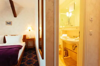 Ein Bett oder Betten in einem Zimmer der Unterkunft Boutiquehotel Schloßpalais