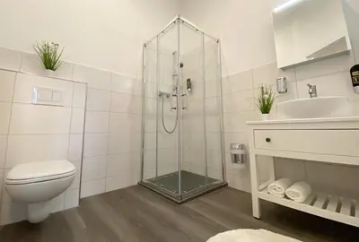 Ein Badezimmer in der Unterkunft REGIOHOTEL Quedlinburger Hof - #HistorischerCharme #ZentraleLage #Wellness #FreeParking