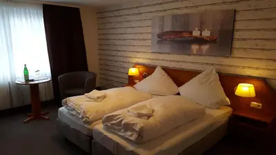 Ein Bett oder Betten in einem Zimmer der Unterkunft Hotel Engel Altenau