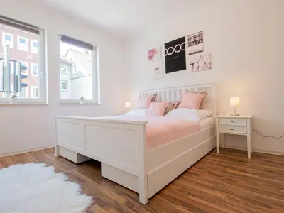 Ein Bett oder Betten in einem Zimmer der Unterkunft EUPHORAS - Top ausgestattete Ferienwohnung mit 105 qm und 3 Schlafzimmern