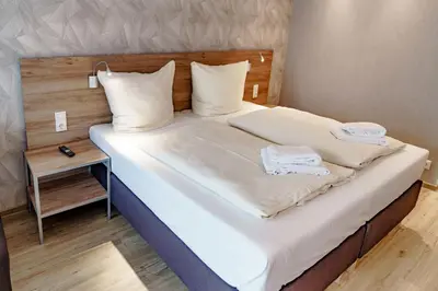 Ein Bett oder Betten in einem Zimmer der Unterkunft Haus am See Luxury HS 224 B