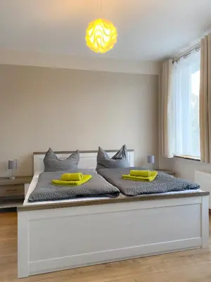 Ein Bett oder Betten in einem Zimmer der Unterkunft Ferienapartments HarzZeit