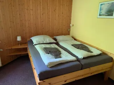 Ein Bett oder Betten in einem Zimmer der Unterkunft Haus am Kurpark