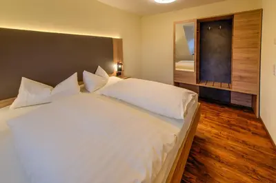 Ein Bett oder Betten in einem Zimmer der Unterkunft Heidequartier Harz