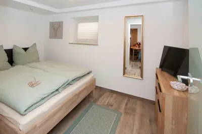 Ein Bett oder Betten in einem Zimmer der Unterkunft Ferienwohnung am Schloss