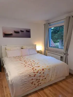 Ein Bett oder Betten in einem Zimmer der Unterkunft FeWo im Harz