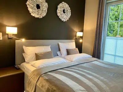 Ein Bett oder Betten in einem Zimmer der Unterkunft country-suites by verdino LIVING - Apartments & Suites